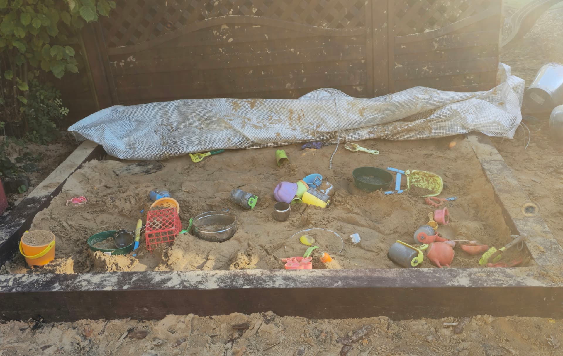 Our large sand pit with digging toys, buckets and moulds